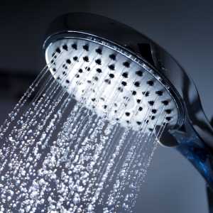 a shower head with water running