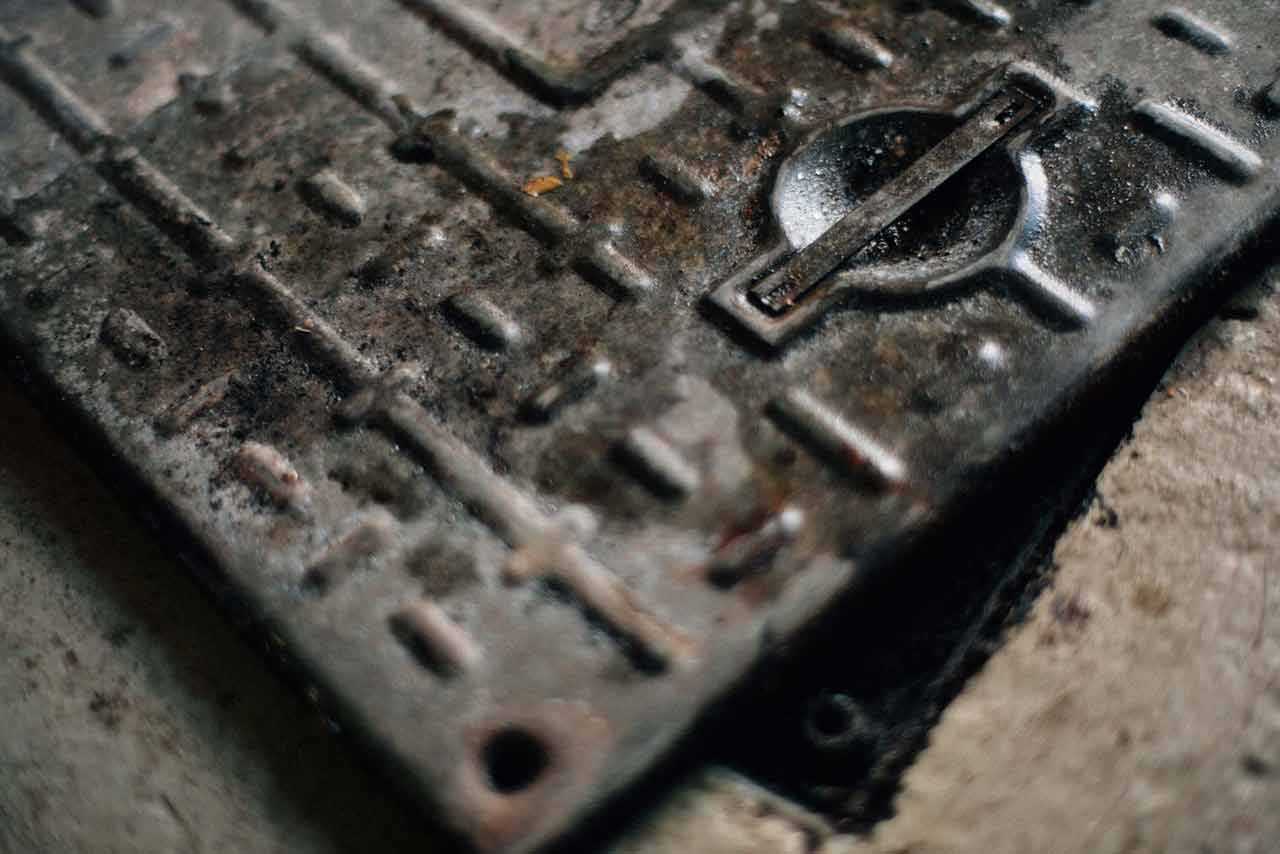 Outside Drain Cover Partially Exposing Drain