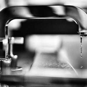 Tap in Black and White with Water Dripping