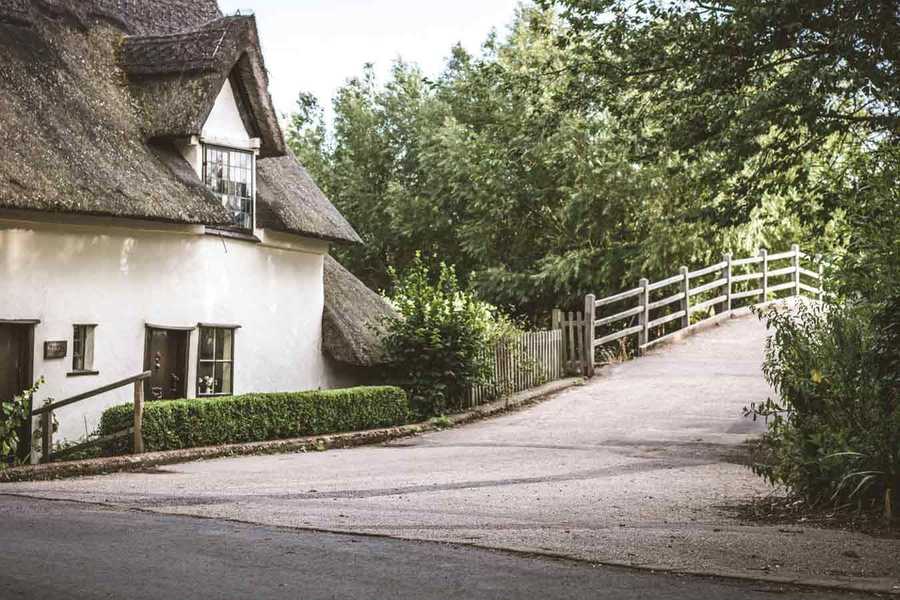 Old House in Countryside Next to Bridge