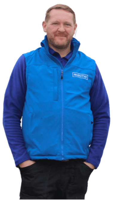 Engineer Wearing Blue Rightio Uniform Smiling With His Hands in His Pockets