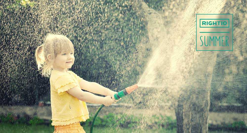 Girl Playing with A Garden Hose