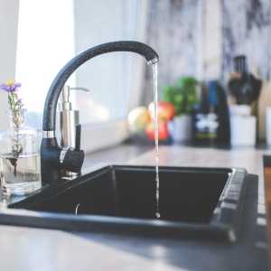a kitchen tap with water flowing