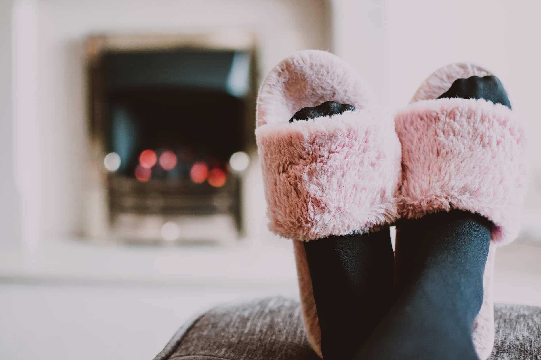 Pink Fluffy Slippers Facing Towards Fire