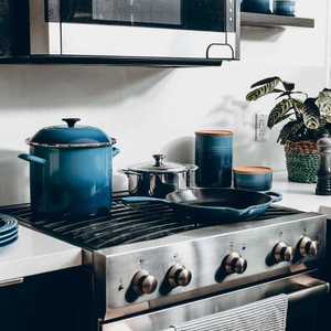 Kitchen with Oven and Blue Pots and Plates
