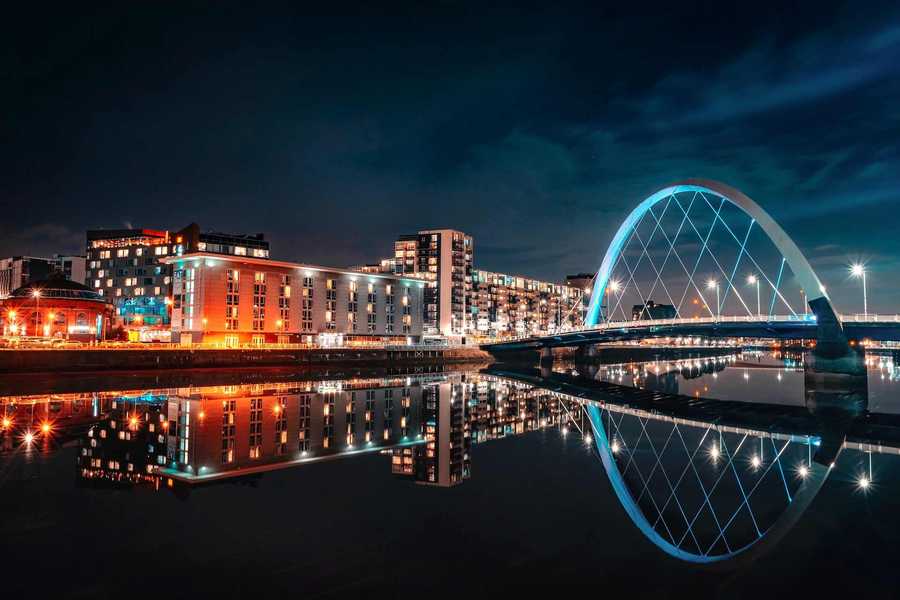 Glasgow City at Night With River and a Bridge in Bright Lights