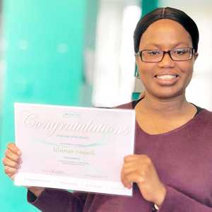 Ulanzo Vassell Holding Employee of The Month Certificate