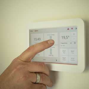 Thermostat with Hand Changing The Settings