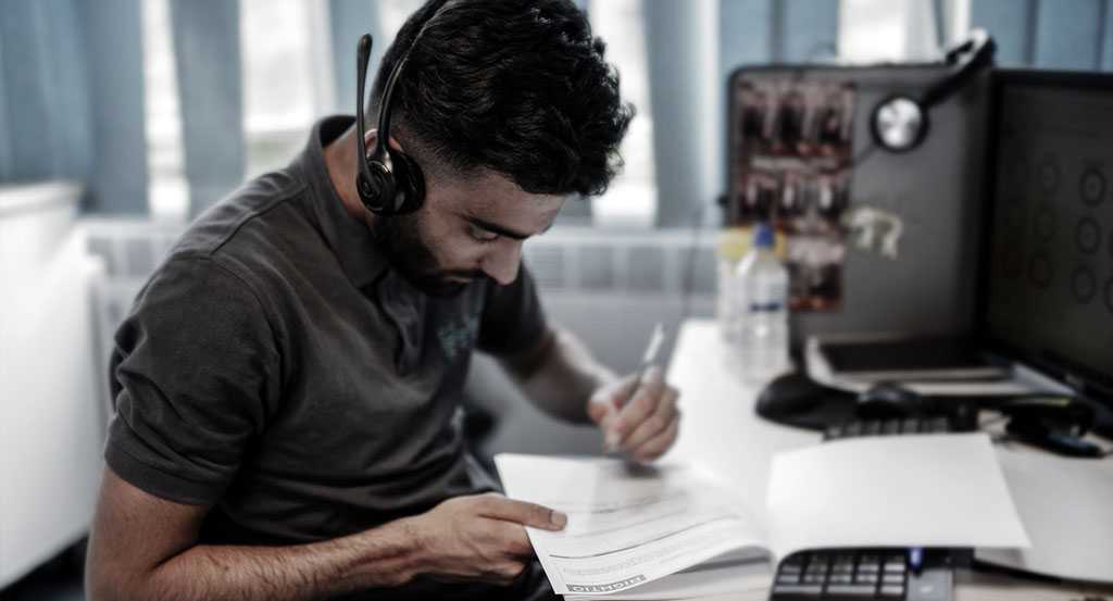 Adnan Akhtar Doing Work at His Desk