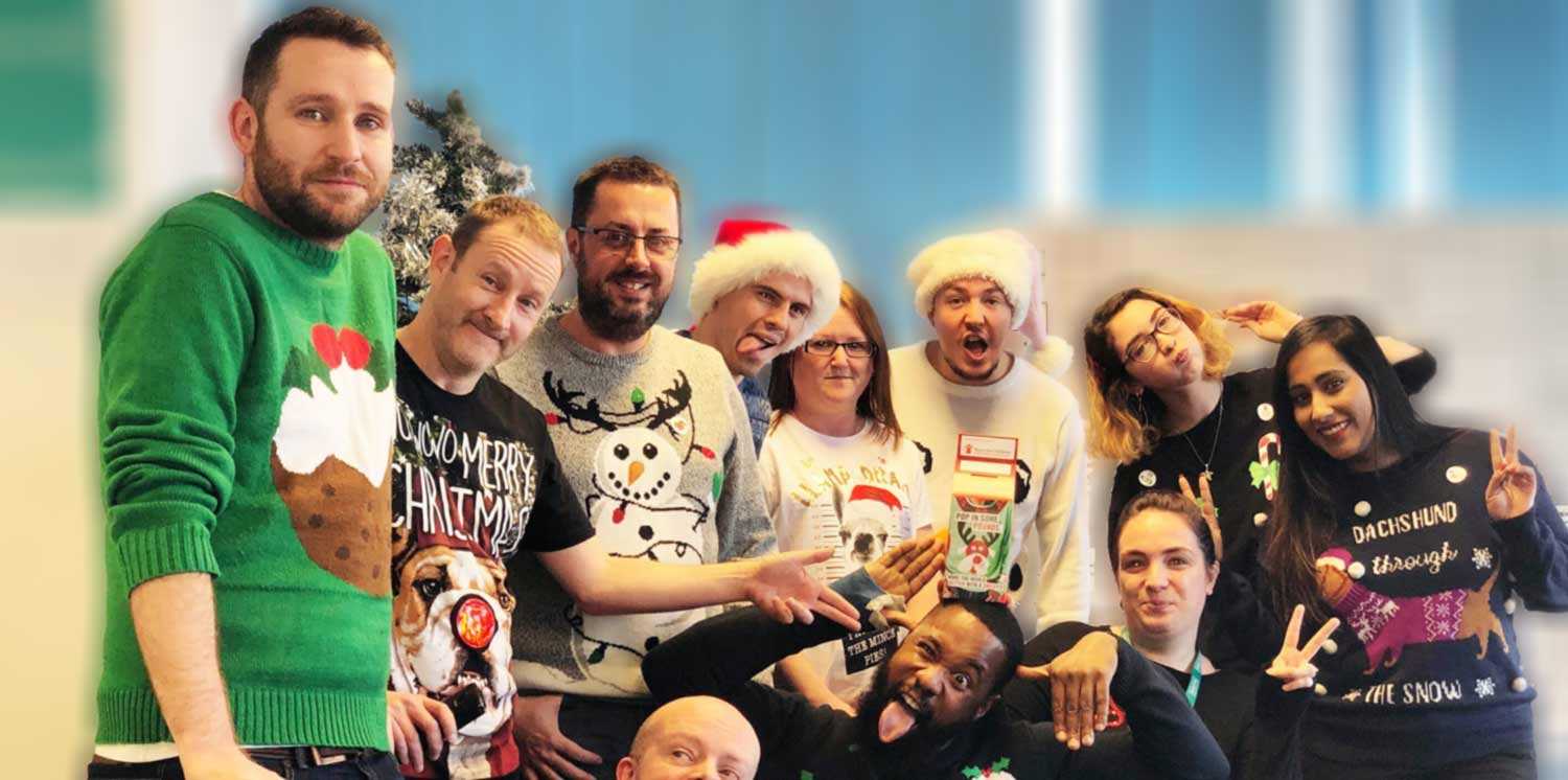 Rightio Staff Wearing Christmas Jumpers Pulling Silly Faces