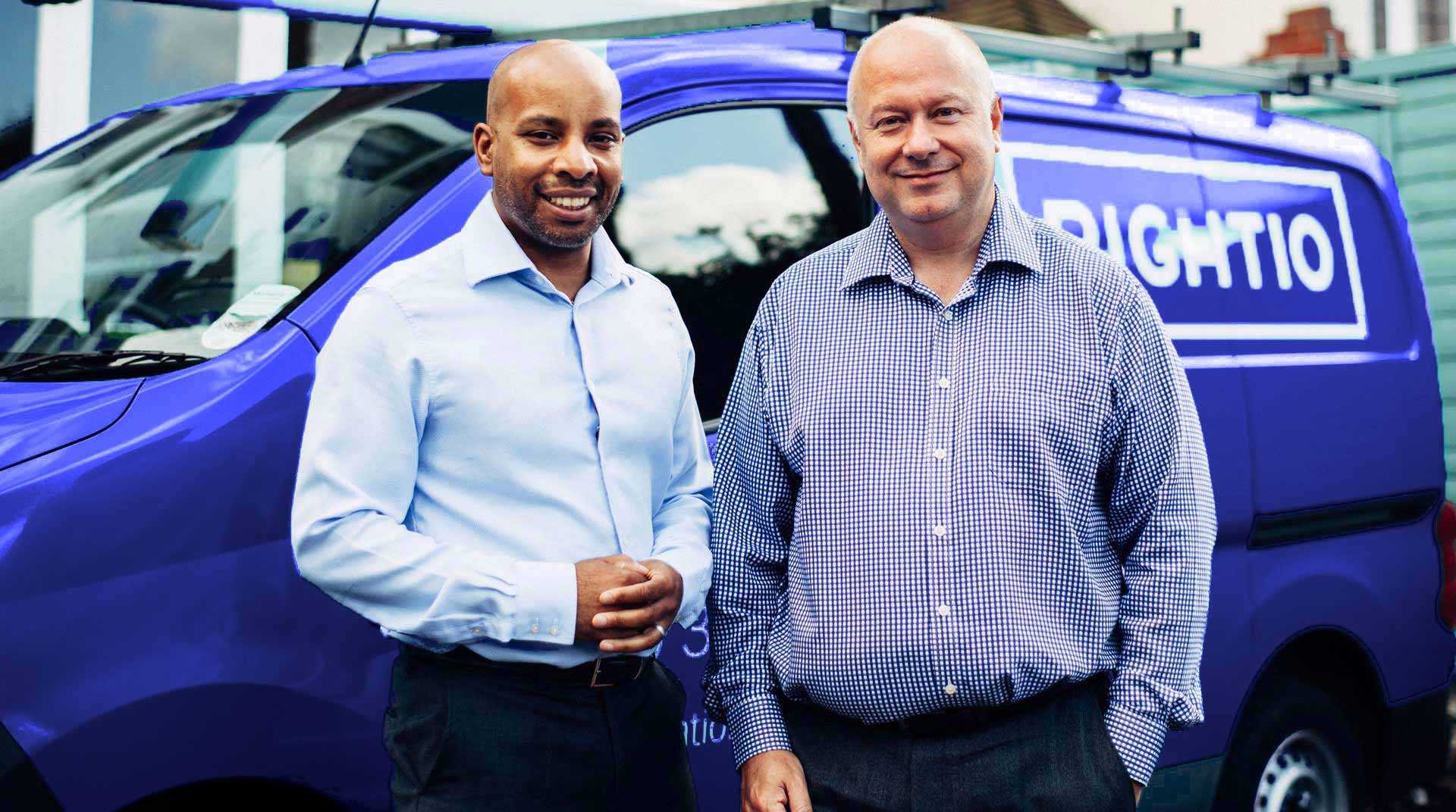 Chris Carswell and Karl Tulloch Standing in Front of Blue Rightio Van